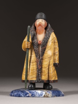 Auction 131<br>A HARDSTONE FIGURE OF A BEARDED MAN HOLDING A STAFF