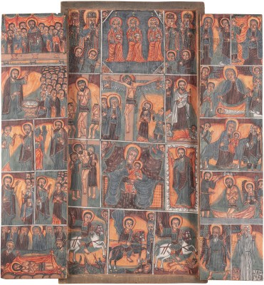 Auction 131<br>A LARGE COPTIC TRIPTYCH SHOWING THE CRUCIFIXION, FEASTS AND SELECTED SAINTS