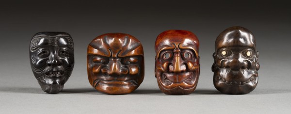 Auktion 132<br>VIER HOLZGESCHNITZTE NETSUKE VON MASKEN