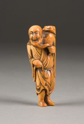 Auktion 139<br>EIN GESCHNITZTES NETSUKE VON GAMA SENNIN AUS ELFENBEIN